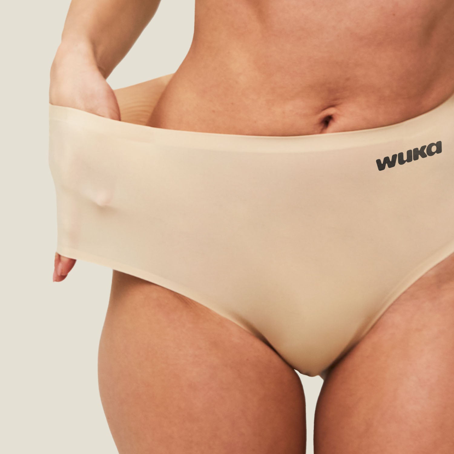 Close-up of teen demonstrating the 3X stretchability of WUKA Teen Seamless Midi Brief, ideal for growing bodies.