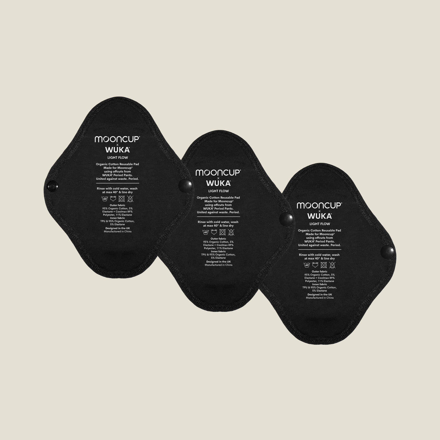 Three WUKA x Mooncup reusable panty liners for light flow, made with GOTS-certified organic cotton and designed for secure, sustainable period care.