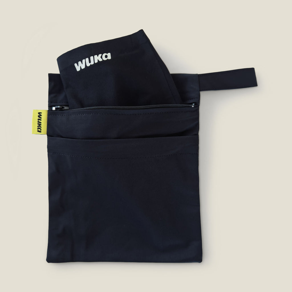 Product shot of the WUKA waterproof 2-pocket changing bag with two zip compartments, designed for storing clean and used period products separately