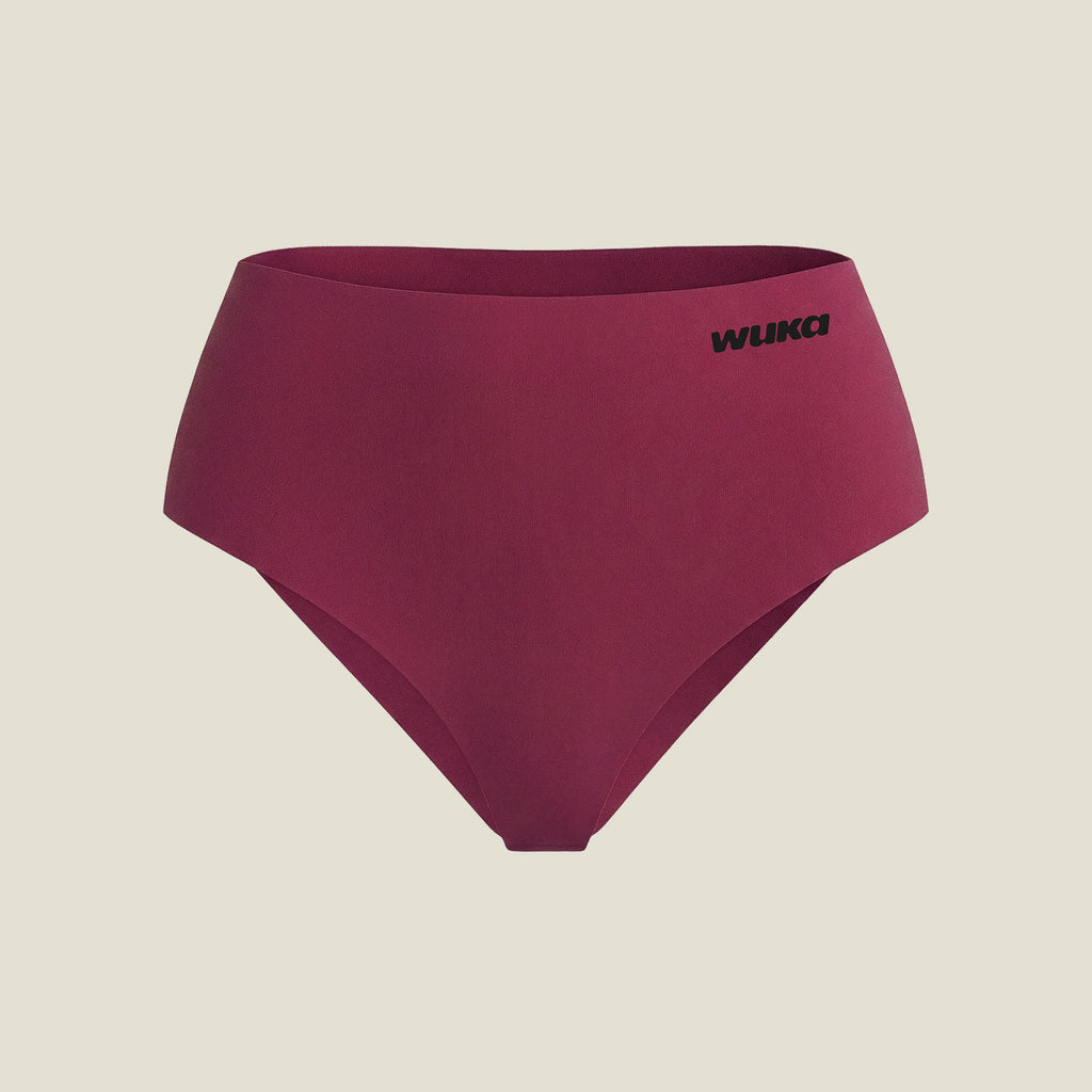 WUKA Stretch Midi Brief in Burgundy stretched to demonstrate adaptive fit across sizes – heavy flow absorbency